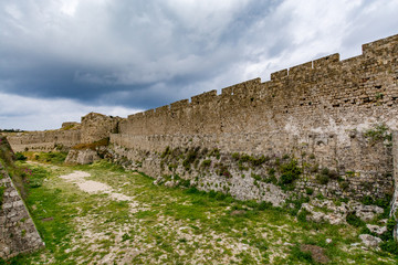 Fototapeta na wymiar Astonishing walls of Rhodes old town on a stormy day, Rhodes island, Greece