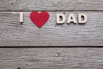Happy Fathers Day card on rustic wood background