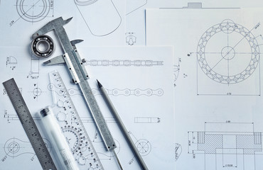 Engineering supplies and blueprints on workplace