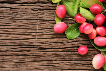 Bengal Currants,Carandas-plum, Karanda on the table.copy space