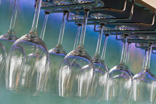 Closeup Of Wine Glasses Hanging On A Stemware Rack