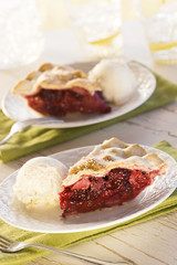 Mixed Berry Pie Slices with Scoops of Vanilla Ice Cream
