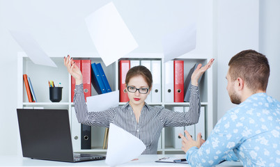 Director in a rage throws documents brought to the signature of the employee.