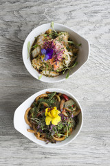 Overhead of Bowls of Stir Fry Vegetable Dishes on Wooden Countertop