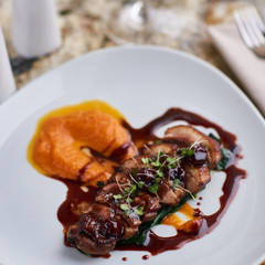 Duck breast Magret with mashed nutmeg pumpkin dressed with porto sauce