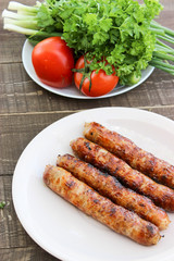 Grilled sausages on the coals