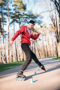 Roller skater, trick exercise in park