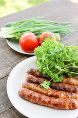 Grilled sausages on the coals