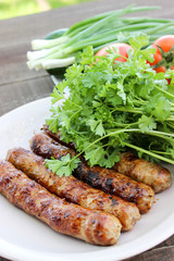 Grilled sausages on the coals