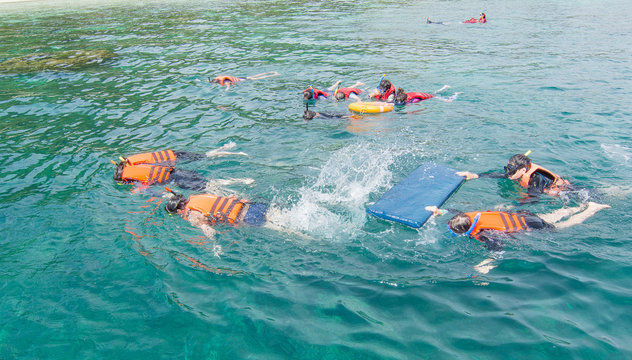 Tourists are snorkelling at Zedetkyikyun Island at Myanmar