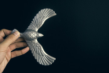 hand pick steel eagle in business leadership concept