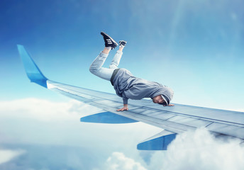 Dance performer, dancing exercise on plane wing