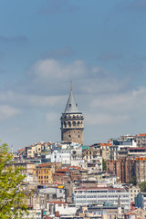 View of  medieval stone Galata Tower in the Galata/Karakoy quarter of Istanbul from the Bosphorus. Turkey.