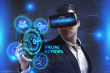 Business, Technology, Internet and network concept. Young businessman working in virtual reality glasses sees the inscription: Online reviews