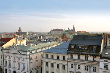 Fototapeta na wymiar Aerial view of the Krakow. Old multistory buildings and tower of monuments in perspective. Poland
