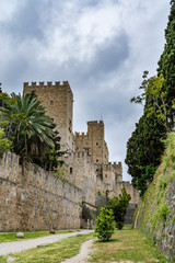 Fototapeta na wymiar Walls of Rhodes old town and Palace of the Grand Master, view from the moat, Rhodes island, Greece