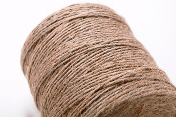Coil of natural rope on white background