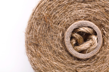 Coil of natural rope on white background