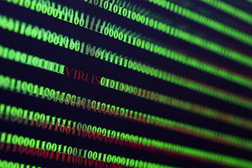 Virus in computer code on black background.