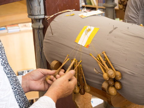 Process of lace-making with bobbins