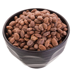 pinto beans  in a ceramic bowl isolated on a white background.