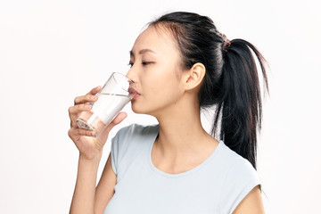 a woman drinks clean water, a diet, the right way of life