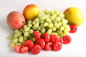 Fresh fruits-mangoes,rose apple,grapes on a white background.