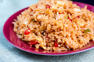 Homemade Chinese fried rice with vegetables and fried eggs