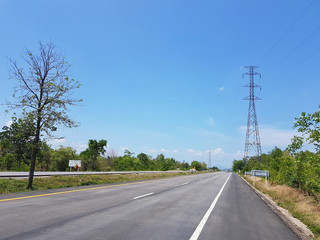 Fototapeta na wymiar superhighway in rural area with high voltage tower, Thailand