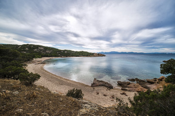 Amazing seascape of a turquoise sea in Italy. Beautiful wild beach of the Emerald coast in Sardinia..