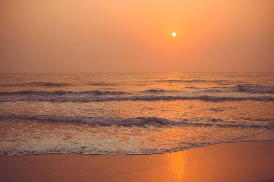 Colorful sunset over the ocean Vagator Beach, south Goa, India.