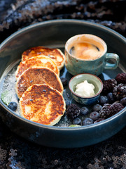 Pancakes with cottage cheese and espresso cup