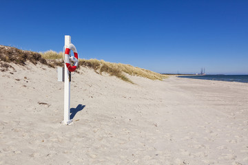 Lifebelt at Baltic Sea beach of Grenaa, Denmark