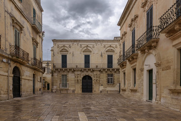 Fototapeta na wymiar Baroque houses in Piazzetta Ignazio Falconieri on a rainy day, historic center of Lecce, Puglia, Italy