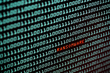Ransomware or Wannacry text and binary code concept from the desktop screen. concept background, selective focus   © Shutter2U