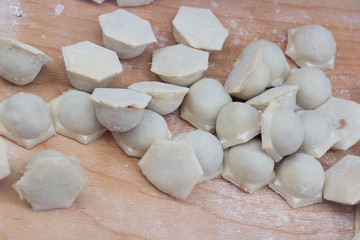 Fototapeta na wymiar The process of making dumplings in the kitchen.