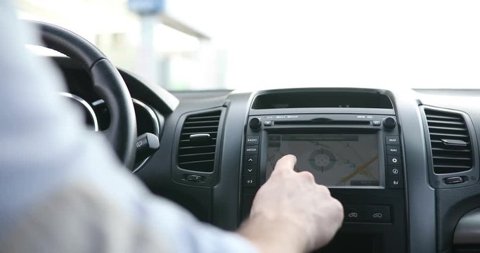 Person using navigation gps in car to travel to destination