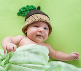 baby boy weared in acorn hat