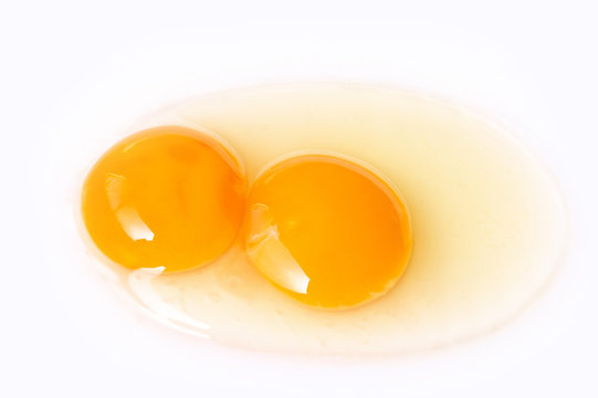 Fresh egg twins on white background, ready for the cooking.