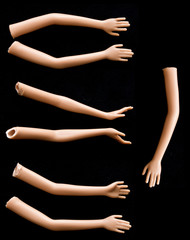 Broken Doll Arms and Hands on Black Background