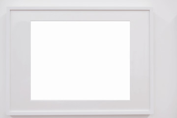 Closeup horizontal blank white frame on white wall, decoration idea