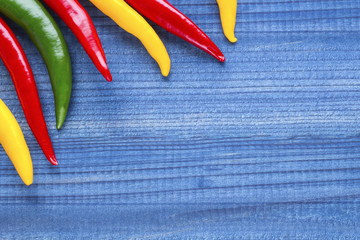 cayenne chilli peppers on wooden background