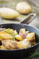 Rustic one skillet potato with rosemary and garlic. 
