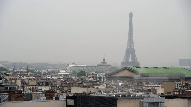 Raining day in Paris. Panoramic view of Paris with Eiffel tower