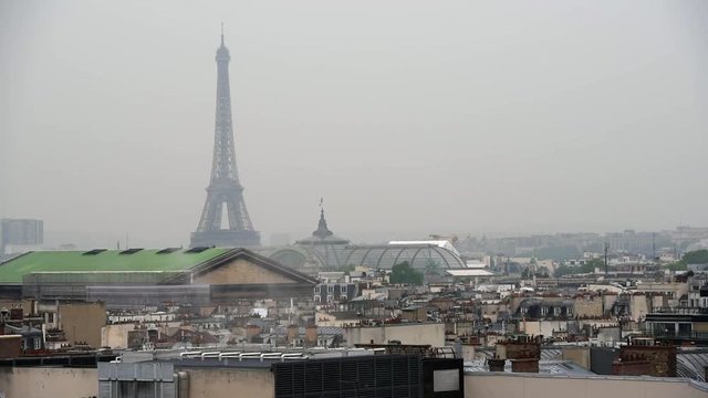 Raining day in Paris. Panoramic view of Paris with Eiffel tower