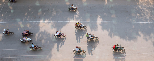 Fototapeta premium Aerial view of people on motorbikes in Southeast Asia (Myanmar)