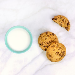 Chocolate chips cookies with glass of milk and copyspace