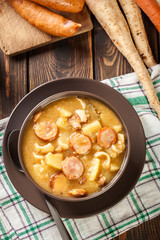 Traditional Polish split pea soup with sausage, bacon and potato