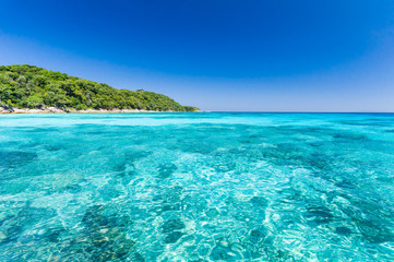 Fototapeta na wymiar Beautiful sea with clear blue sky and island as background.