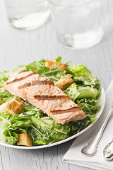 Grilled Salmon Caesar Salad with Glass of Water